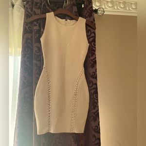 It’s a beautiful Marciano bandage mini dress with a lot of details